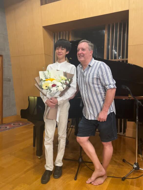 Young pianist with audience member